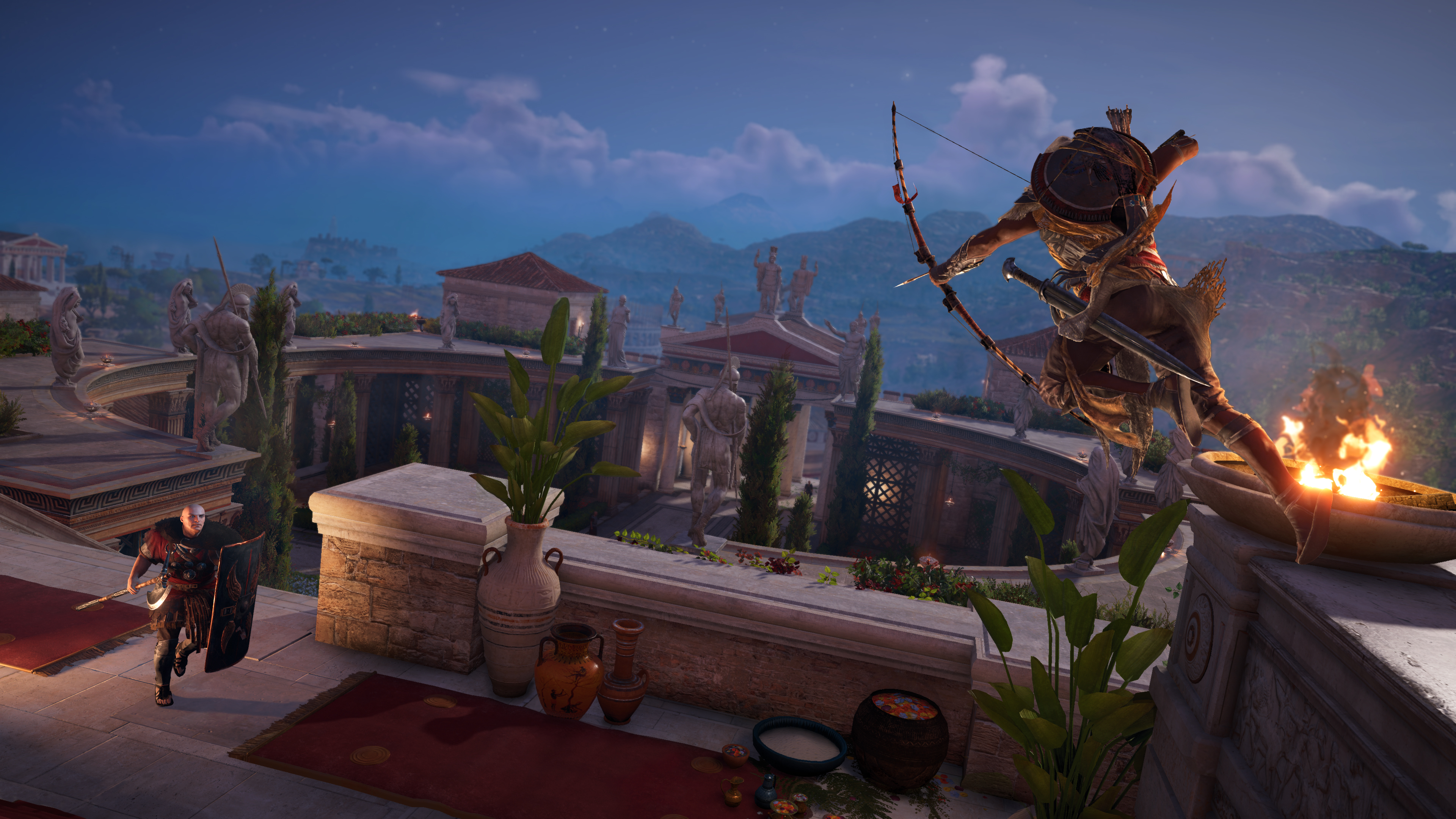 Assassin's Creed Spielszene. Ein Krieger mit Bogen schießt Pfeile. Gebäude und Himmel im Hintergrund.
