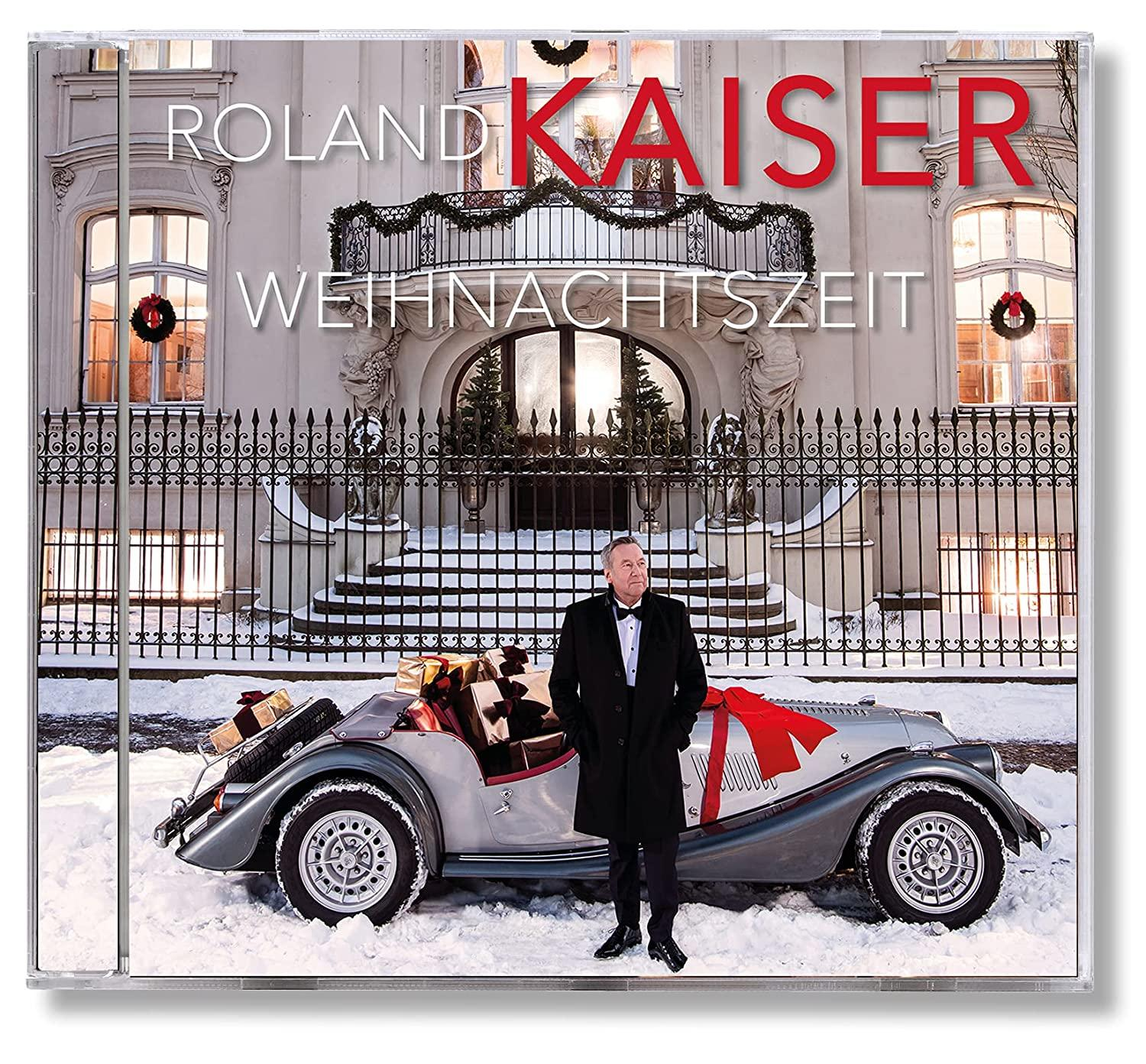 CD-Hülle mit einer Winterszene eines Mannes im Mantel vor einem Auto.
