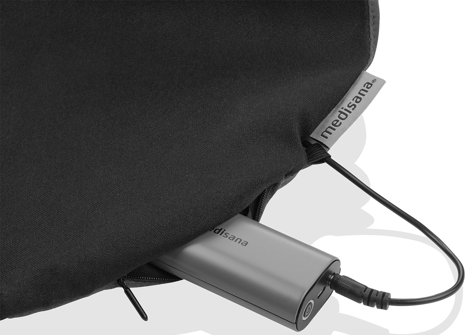 A silver power bank is plugged into a black pillow case. The case has a zipper and the brand name is visible.