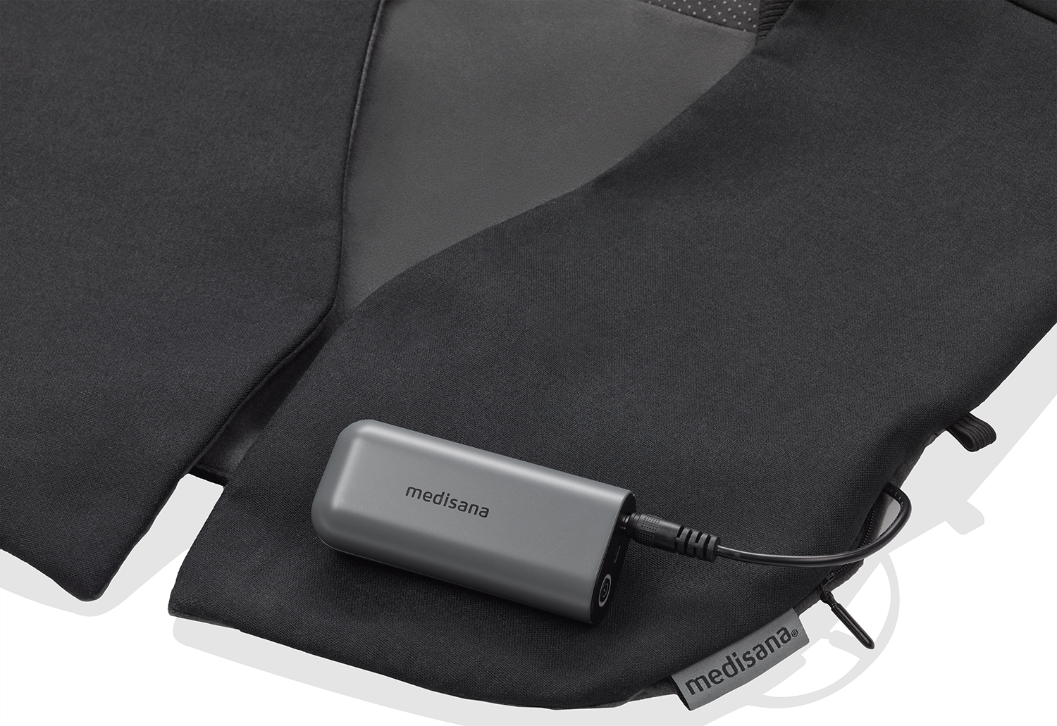A gray Medisana device with a black cable on a black fabric. The Medisana logo is on the device and fabric.