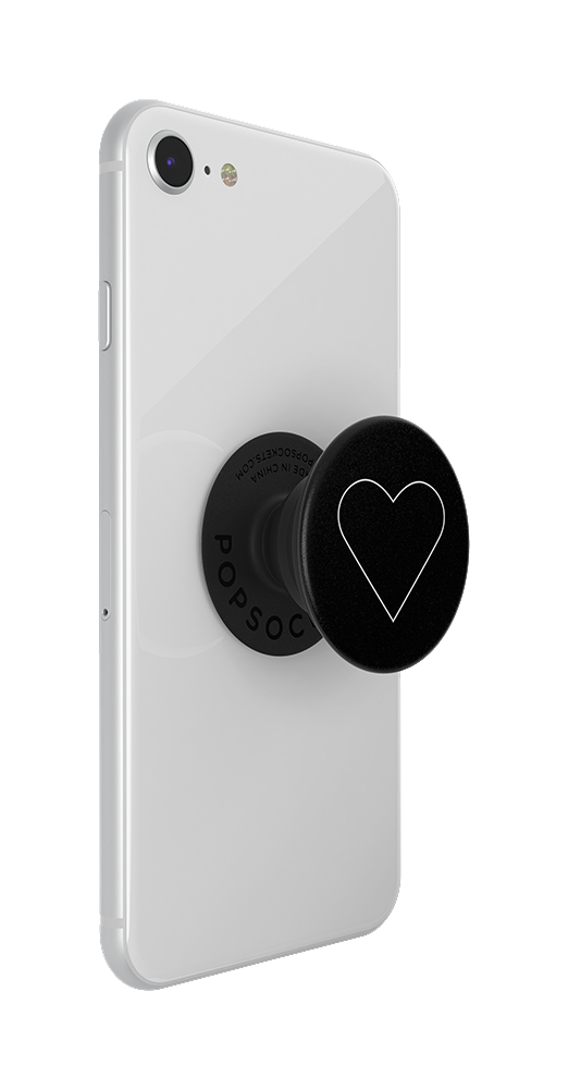 Ein weißes Telefon mit einem schwarzen Pop-Socket mit einem weißen Herzdesign.