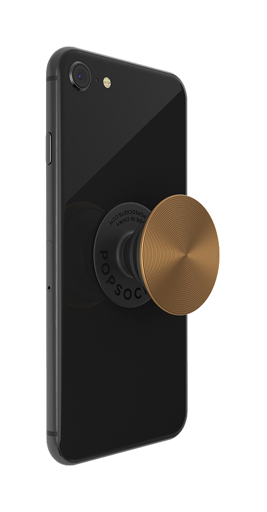 Schwarzes Telefon mit kupferfarbenem PopSocket. Der PopSocket hat ein kreisförmiges Design.