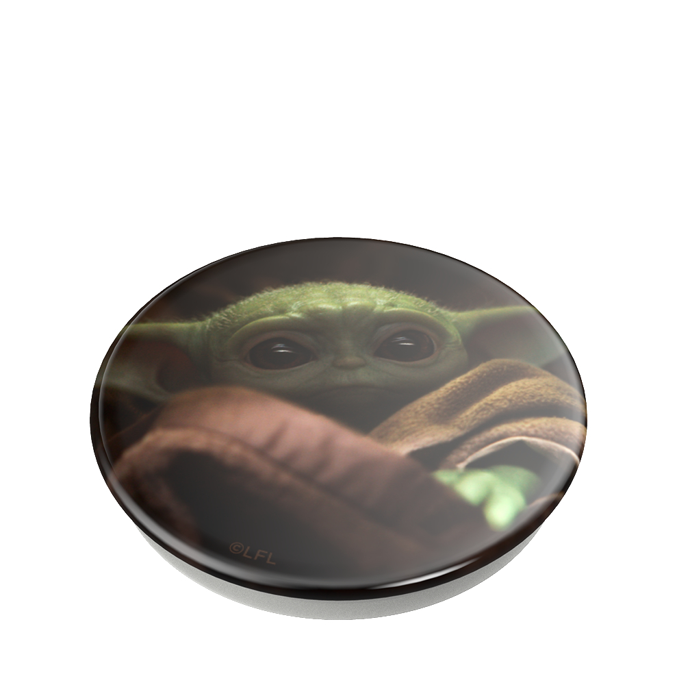 Nahaufnahme eines Grogu PopSockets, mit Grogu, der unter einer Decke hervorlugt.