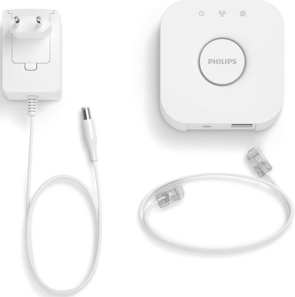 Pont Philips Hue blanc avec adaptateur secteur et câbles. Fond blanc.