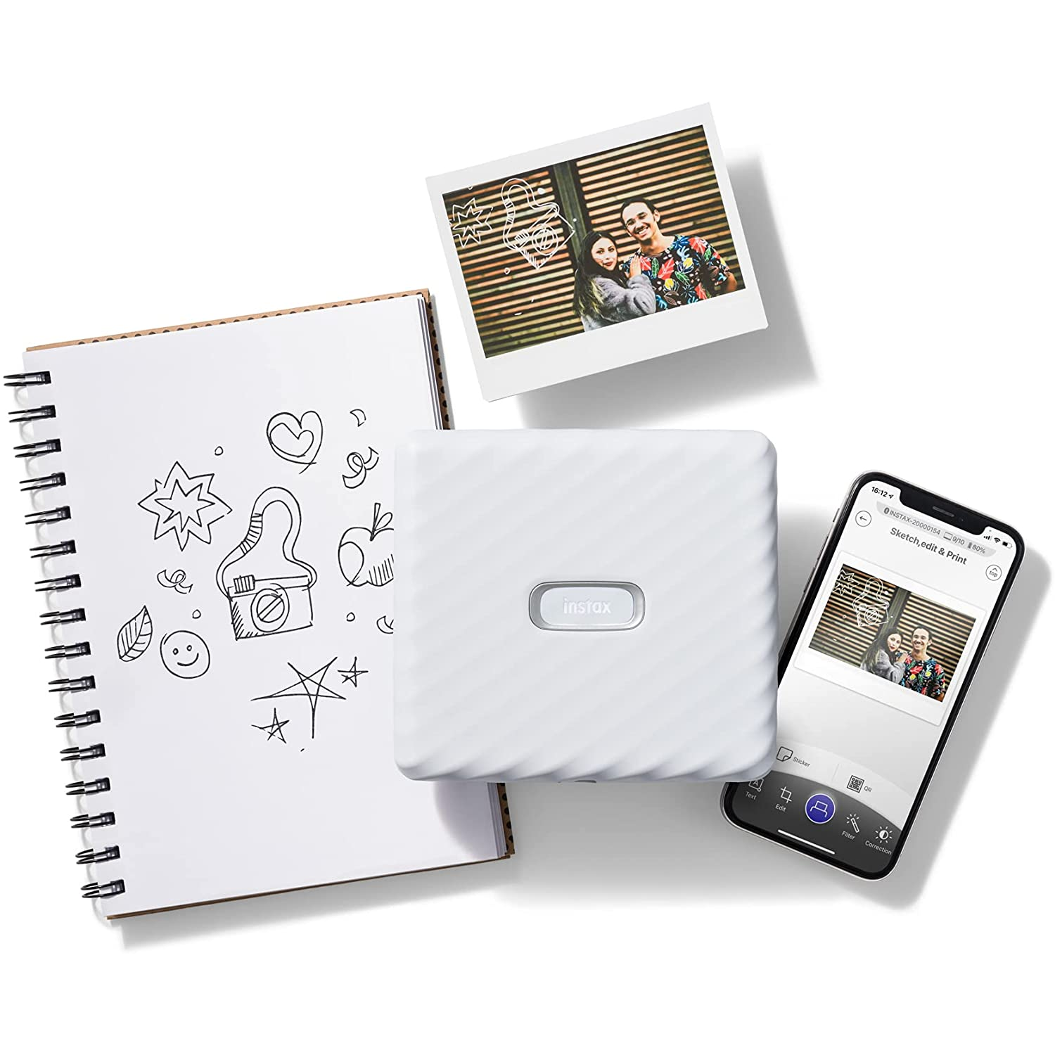 Impresora de fotos Instax, fotos, teléfono con foto y cuaderno de bocetos.