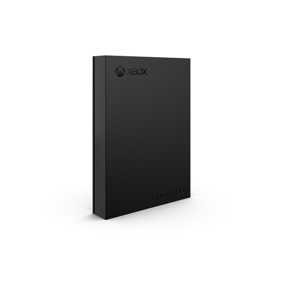 Zwarte externe Xbox harde schijf op een zwarte achtergrond.