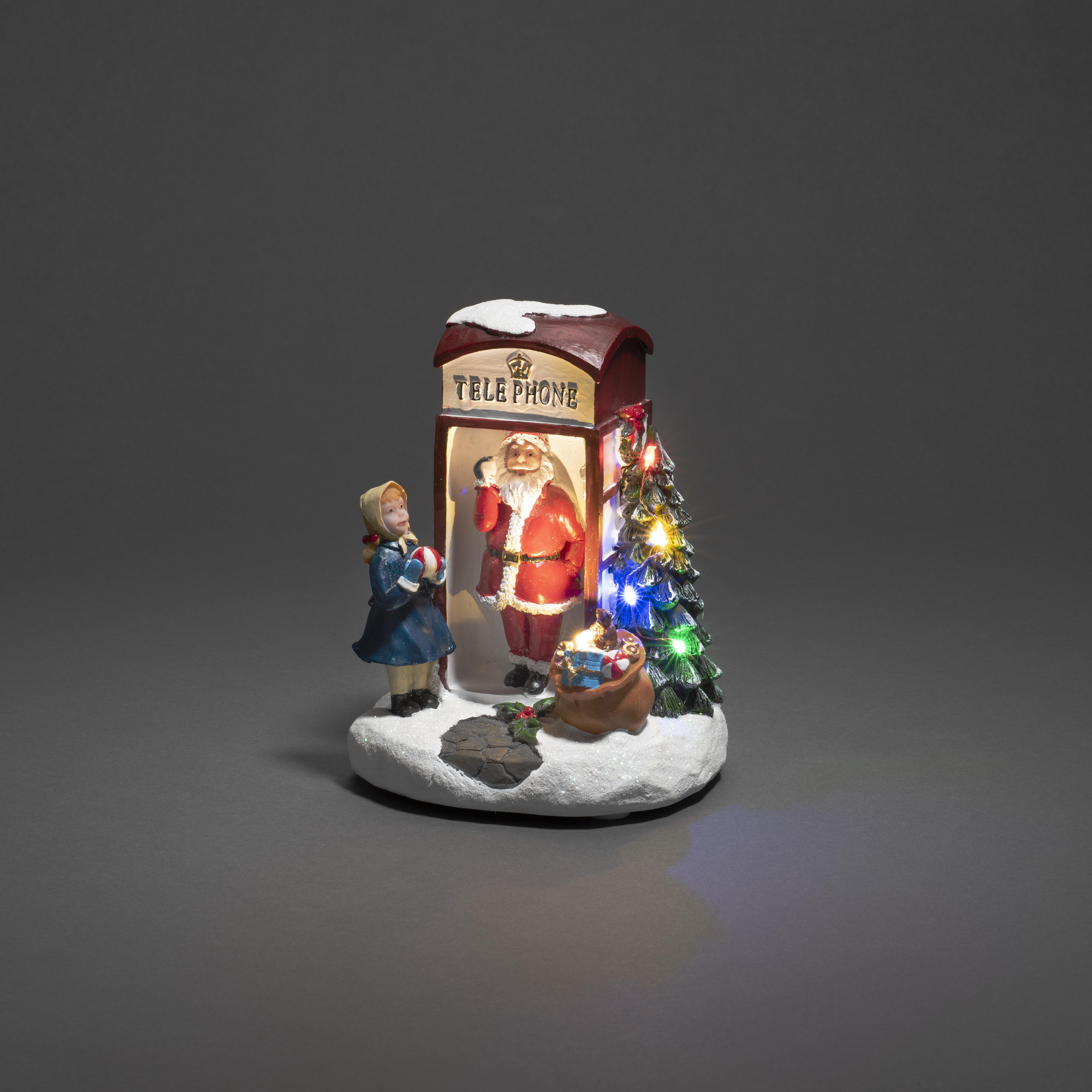 Eine Weihnachtsausstellung zeigt den Weihnachtsmann in einer roten Telefonzelle.