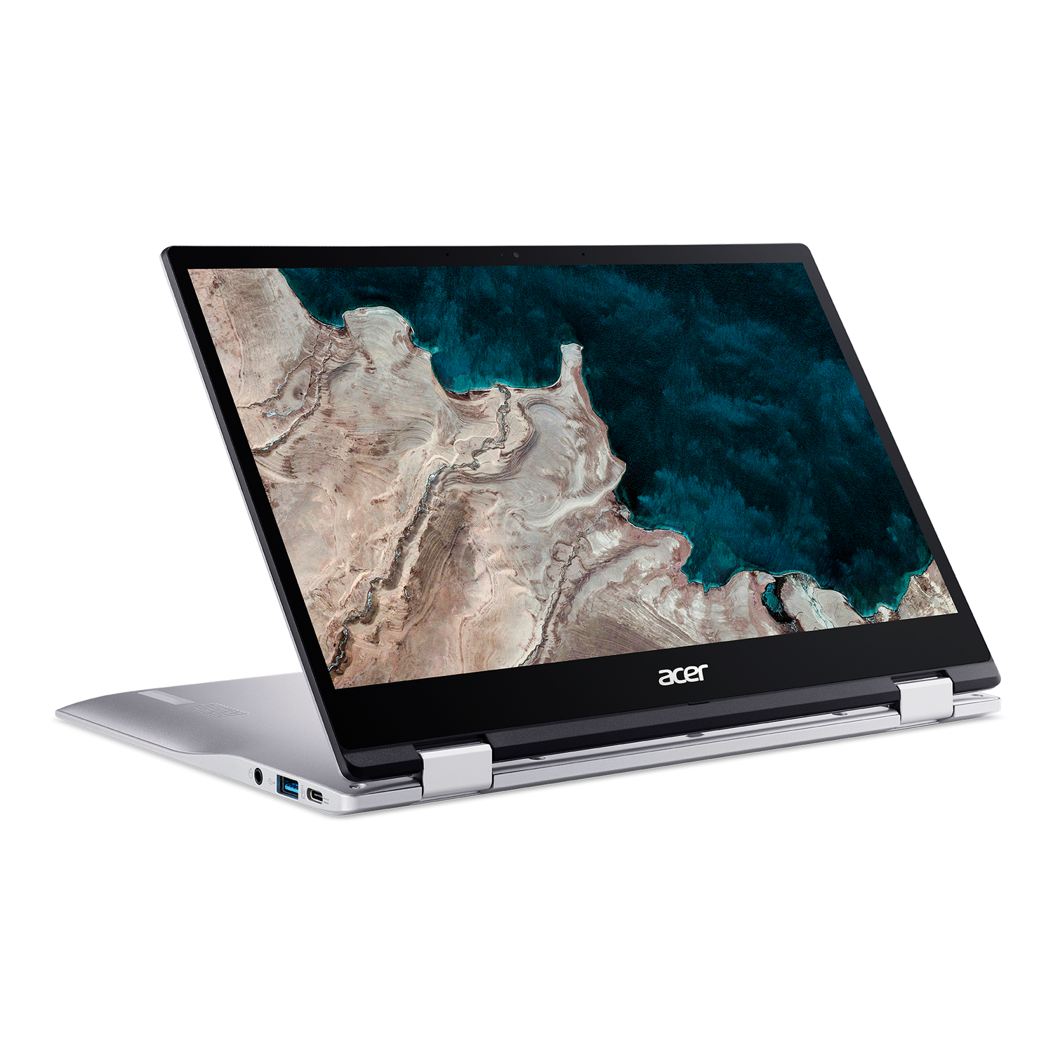 Laptop plateado con pantalla negra, abierto en ángulo. La pantalla muestra un paisaje.