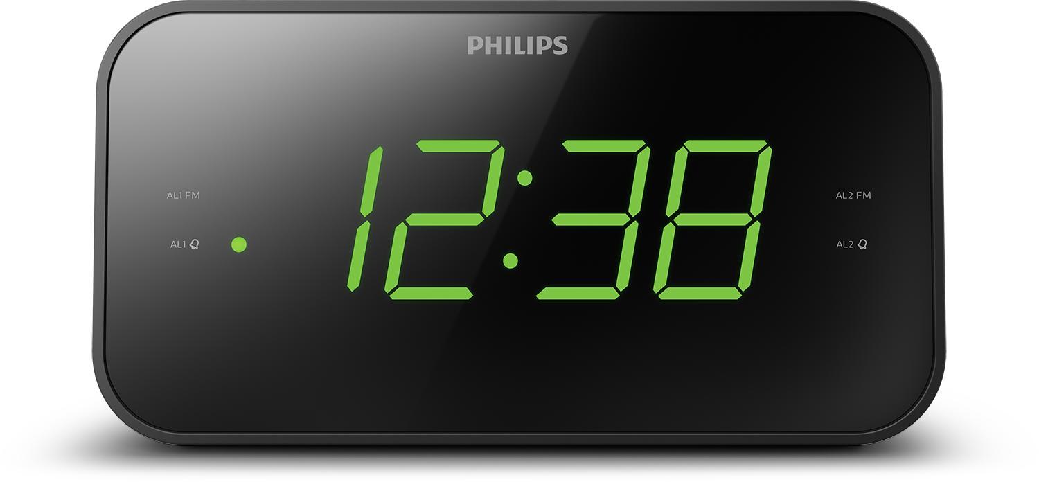 Black digital alarm clock with green numbers. The time is 12:38. Philips logo is visible.