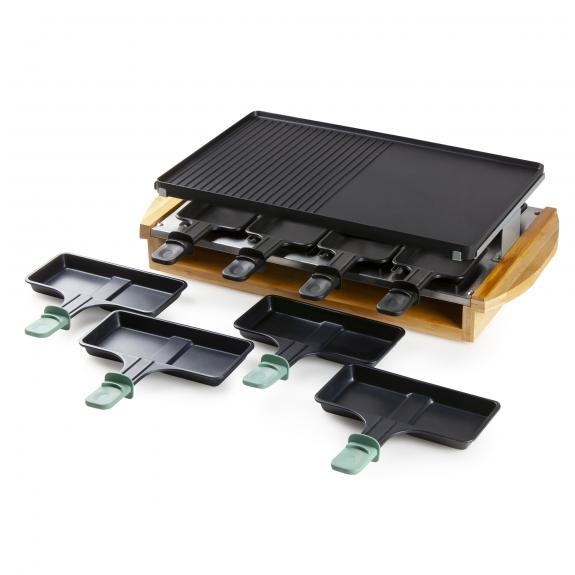 Een raclette grillset met een zwart grillrooster en verschillende zwarte pannetjes met groene handvatten.