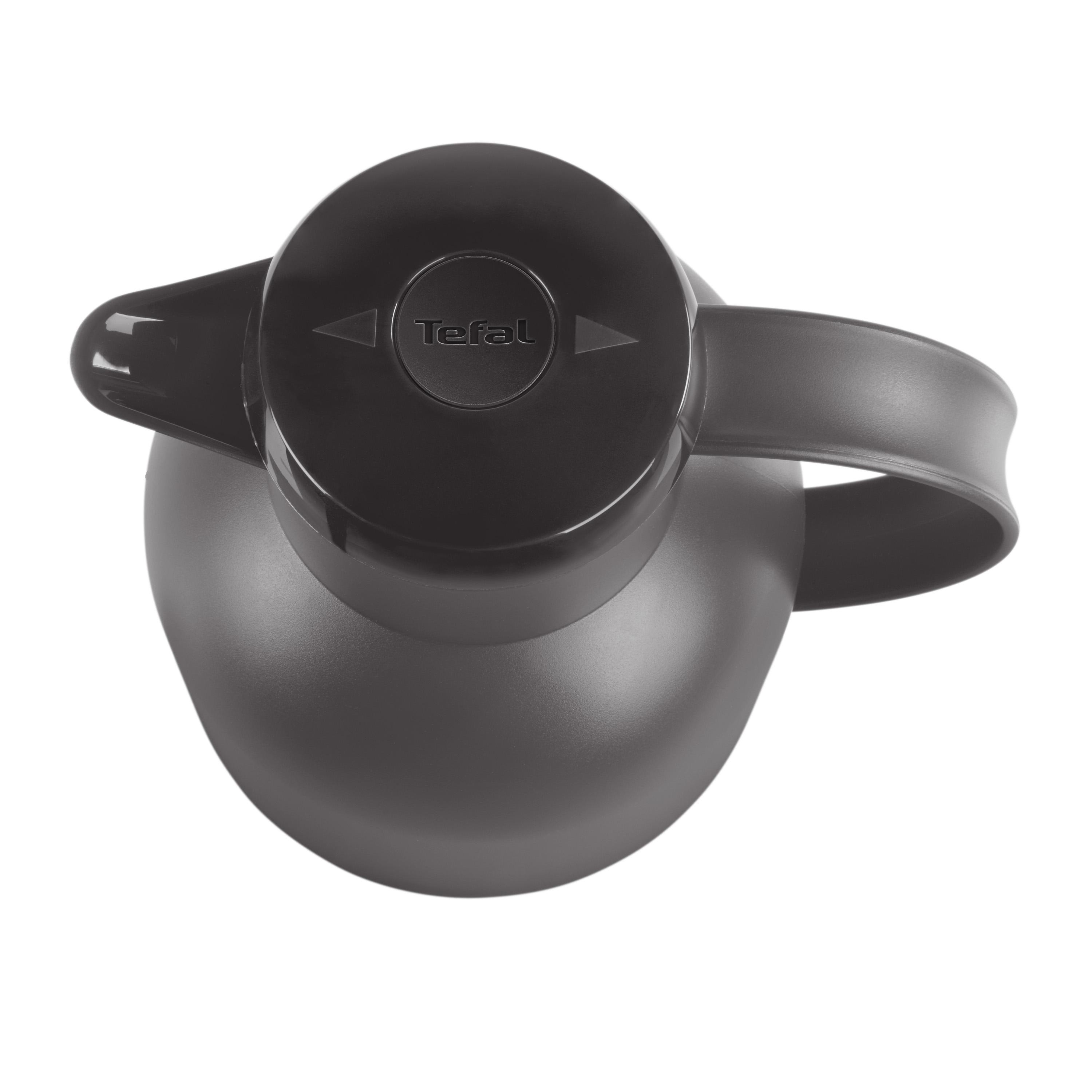 Schwarze Tefal Thermoskanne. Der Deckel hat den Markennamen und einen Pfeilindikator.