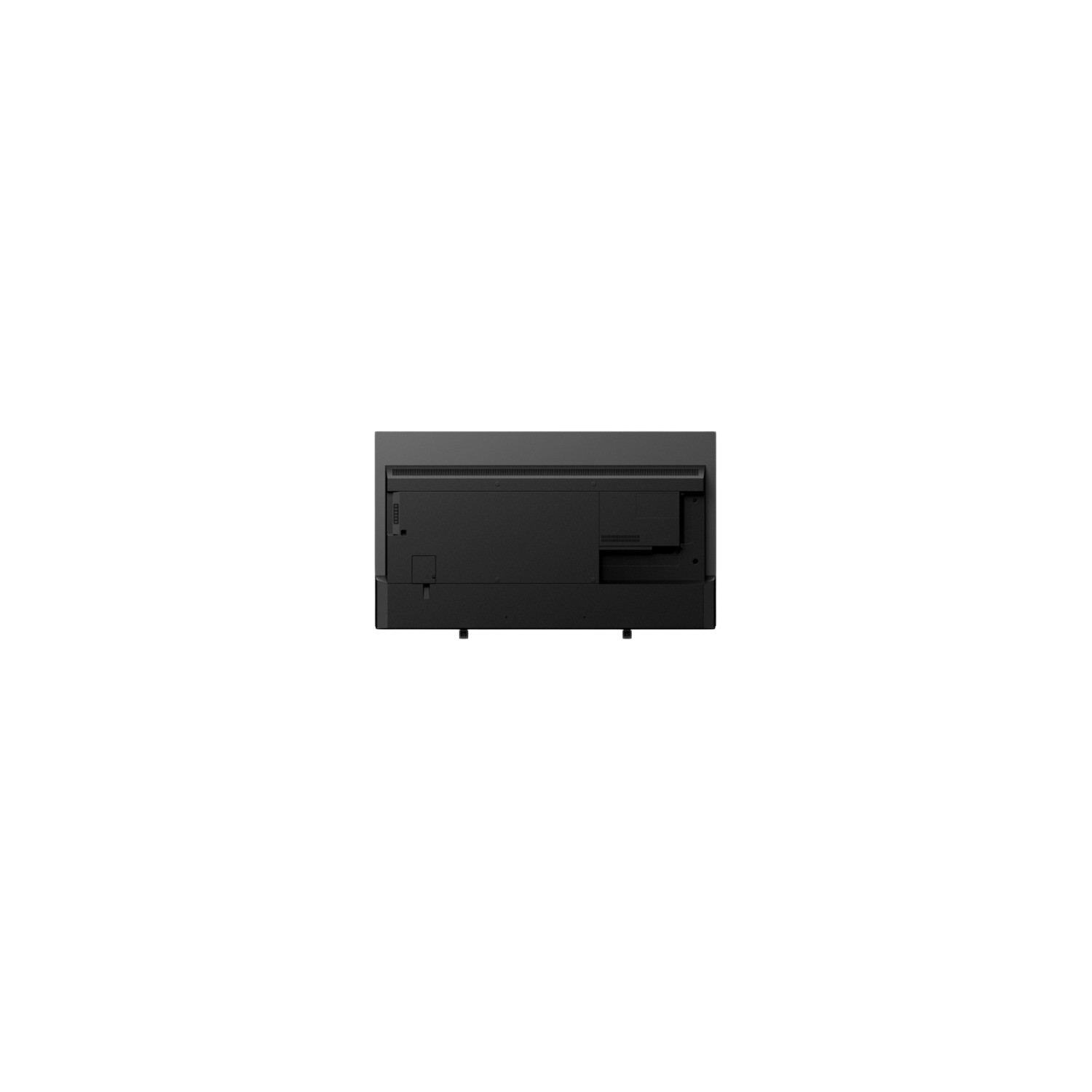 La parte trasera de un monitor negro sobre un fondo negro. El monitor está apagado.