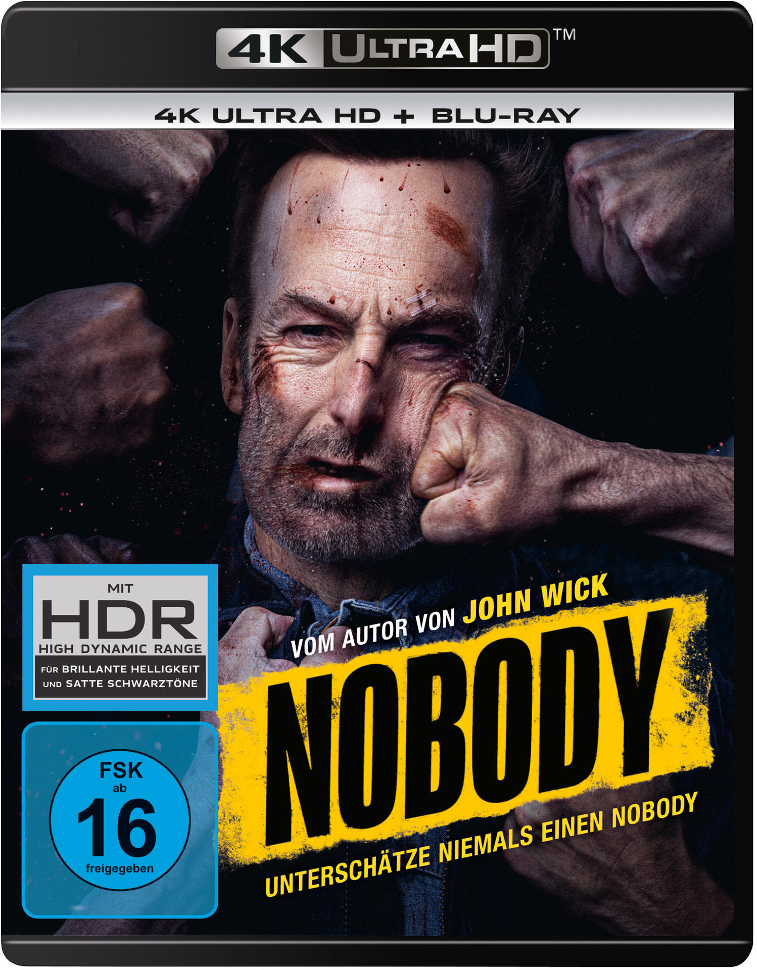 Filmcover: ein verletztes Gesicht mit Fäusten drumherum, Titel 'Nobody'.