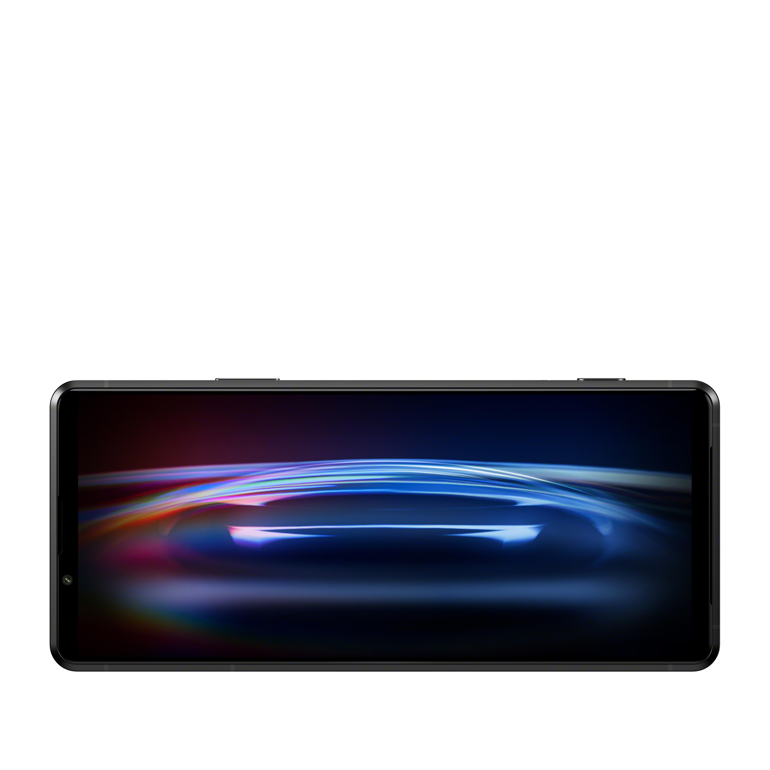 Ein schwarzes Smartphone mit einem Bildschirm, der bunte abstrakte Formen zeigt.