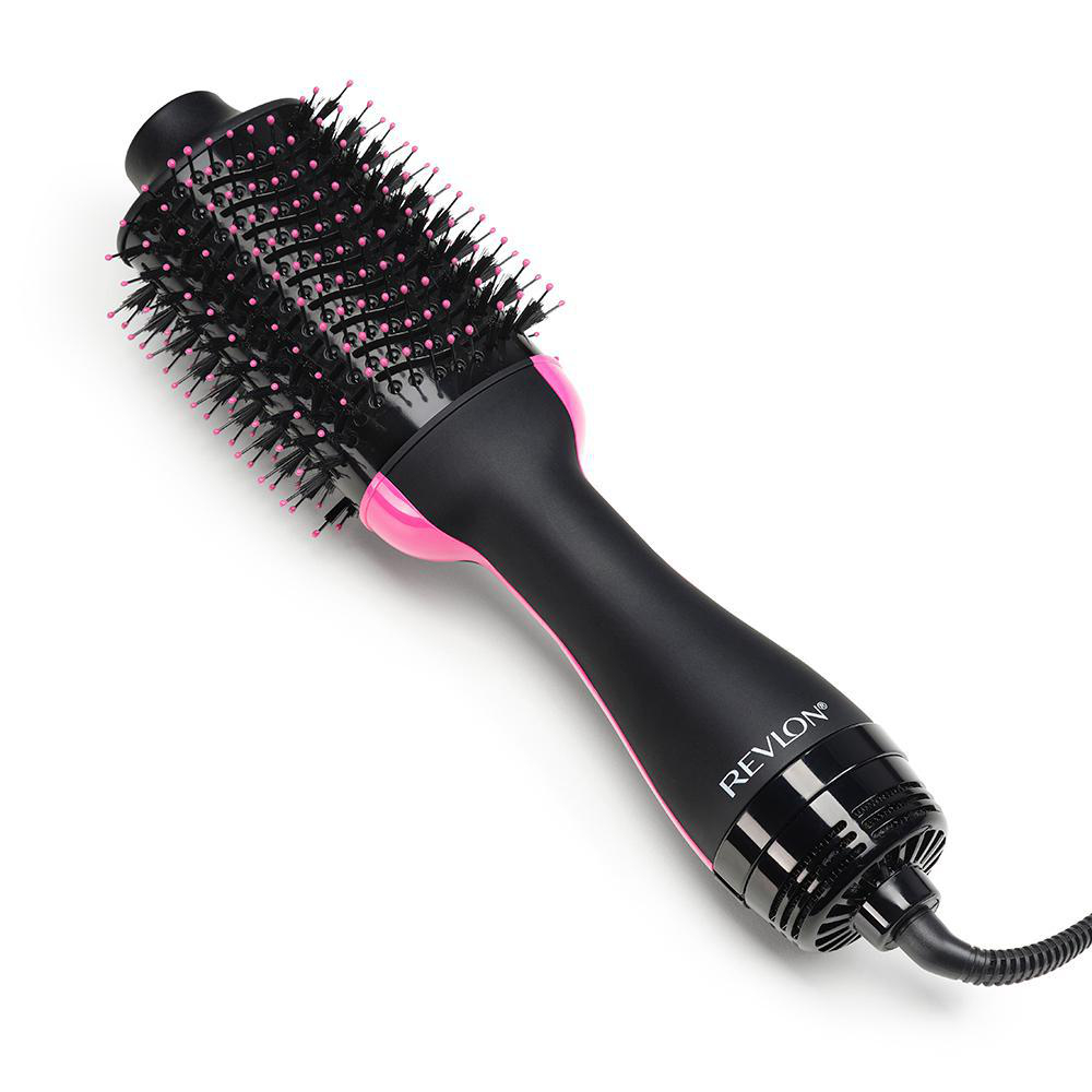 Eine schwarz-rosa Revlon Haartrocknerbürste auf weißer Oberfläche.