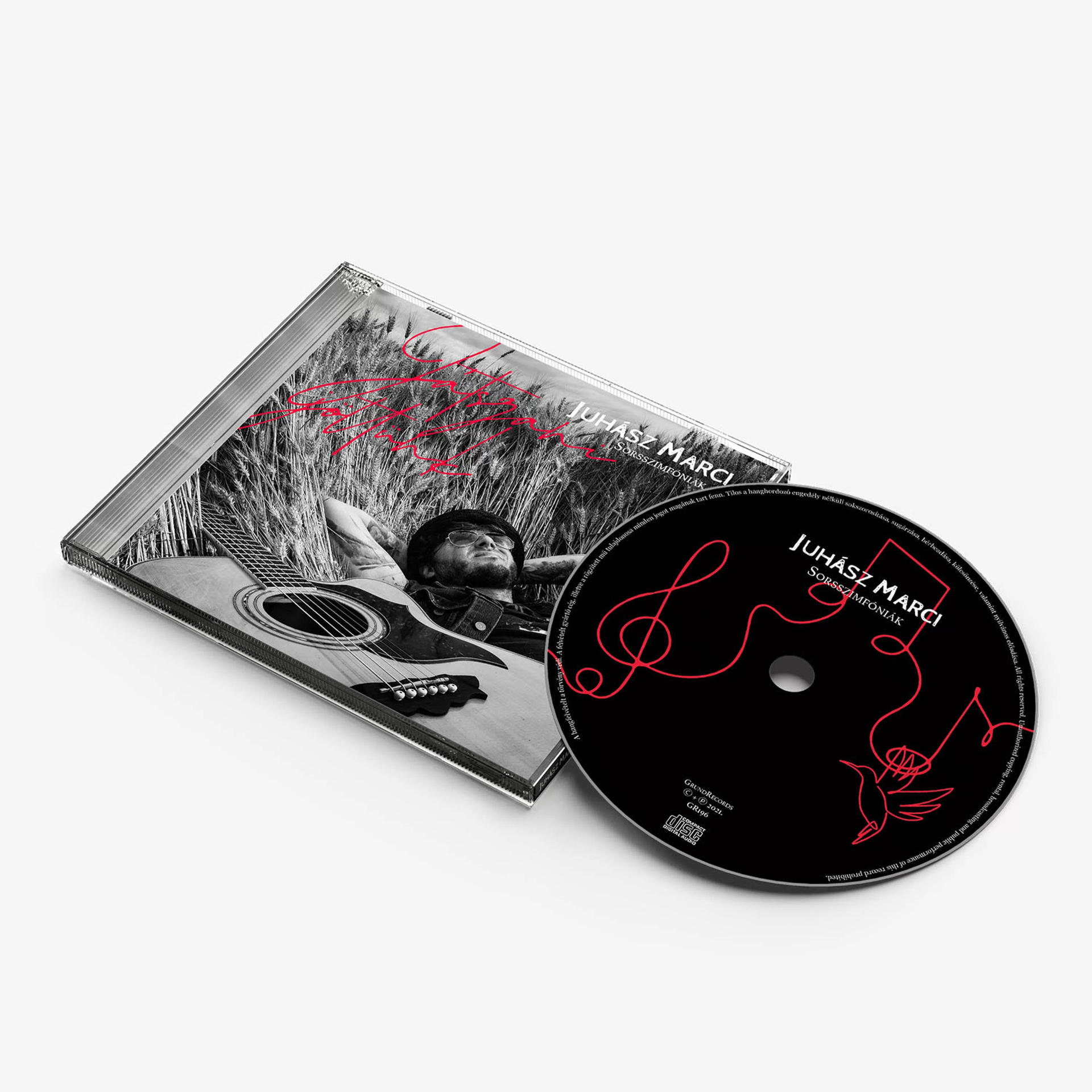 CD tok és lemez Juhász Marci album borítójával.