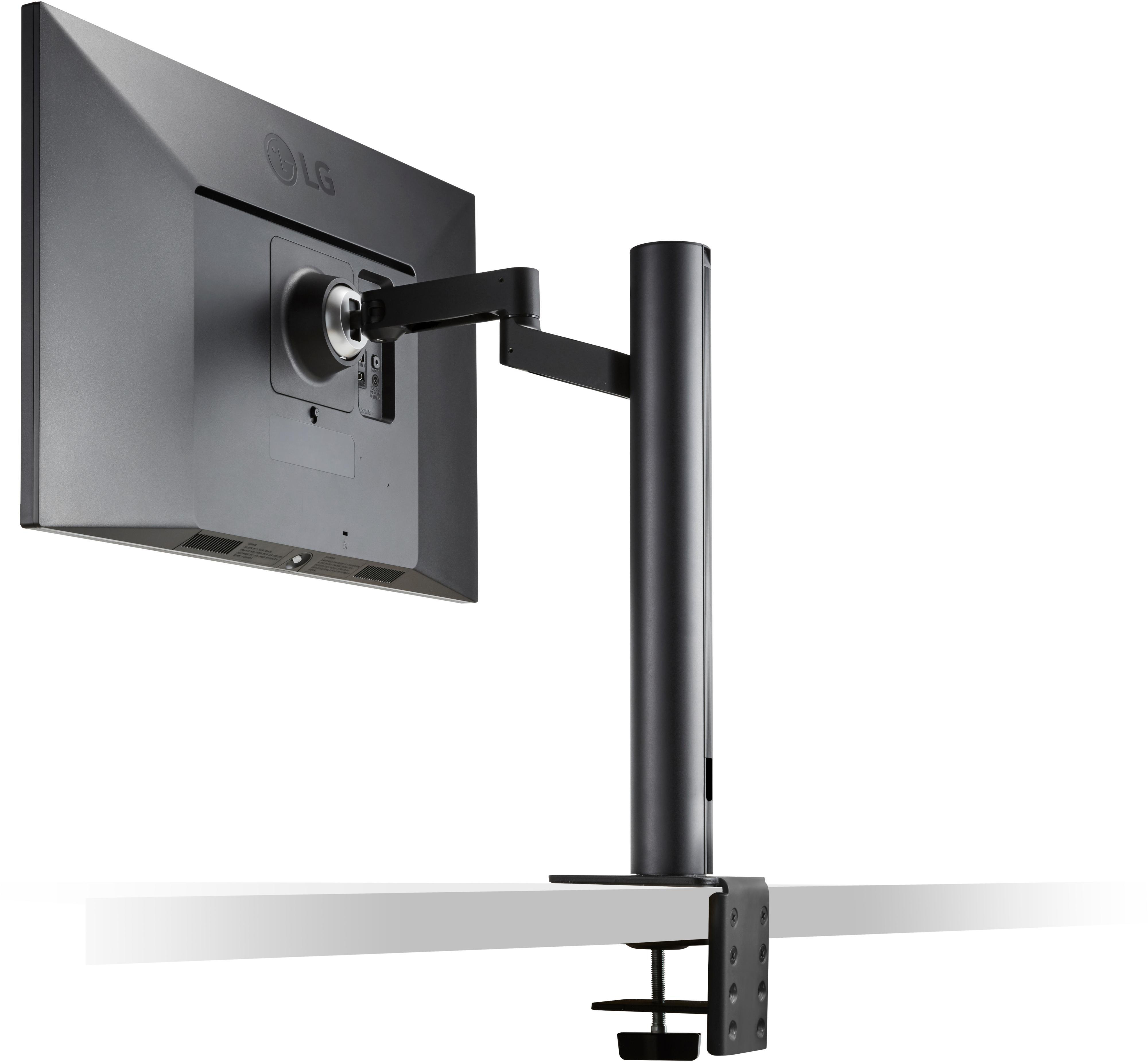 Ein Computermonitor, montiert an einem schwarzen Arm, der an einem weißen Schreibtisch befestigt ist.