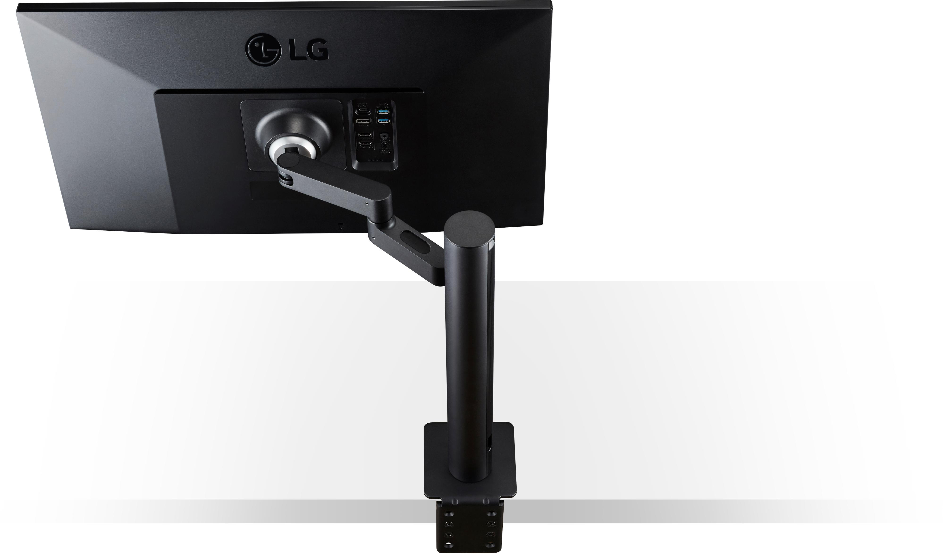 Schwarzer LG-Monitor von hinten, auf einem schwarzen Ständer montiert. Weiße Oberfläche im Hintergrund.