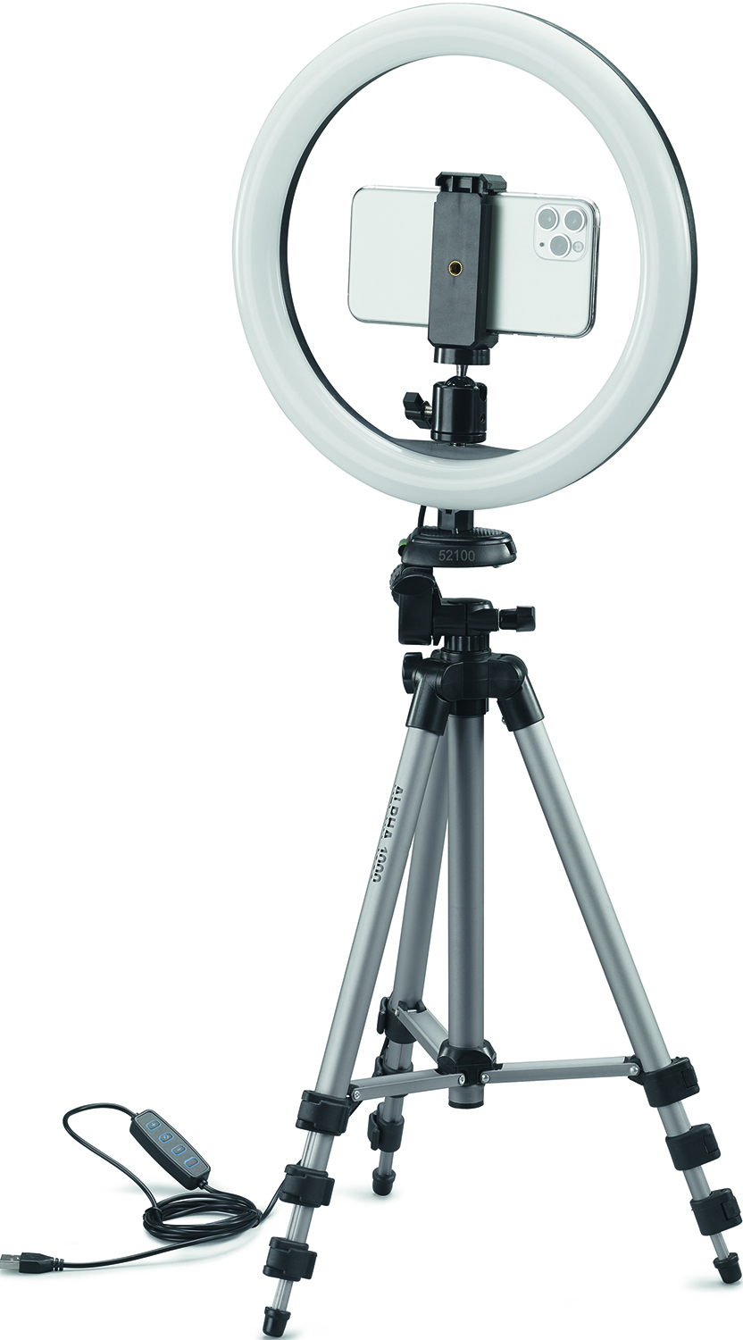 A ring light with a phone attached, on a tripod, against a white backdrop.