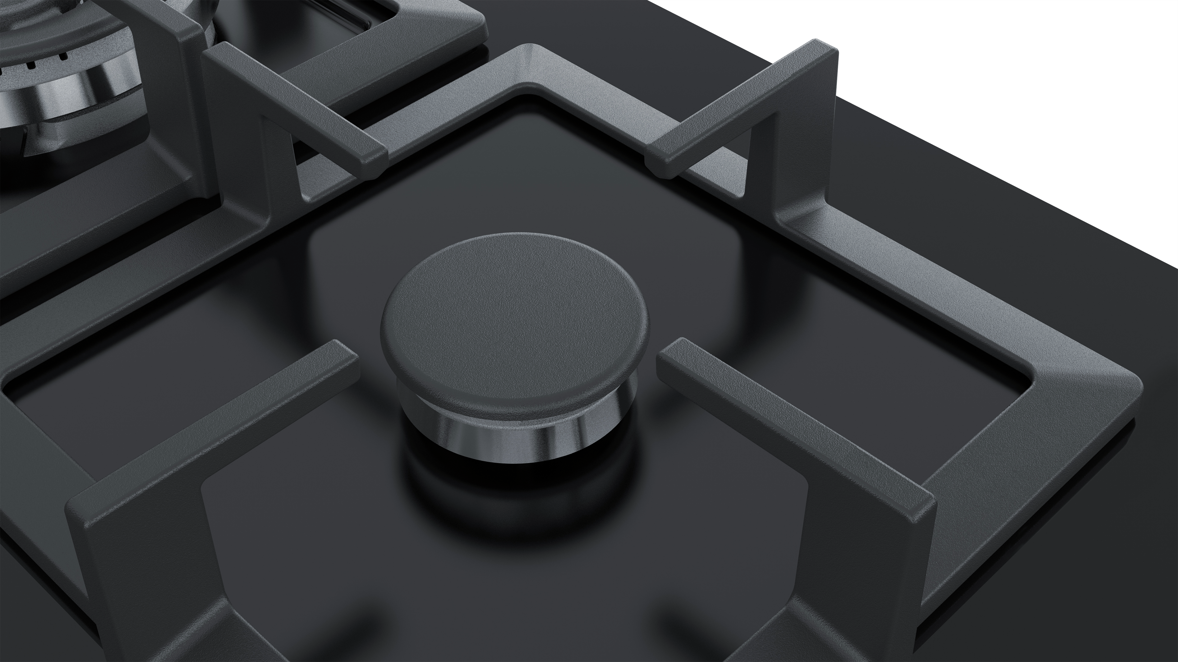 Close-up of a black stovetop with four burners. The burners have black grates and a central knob.