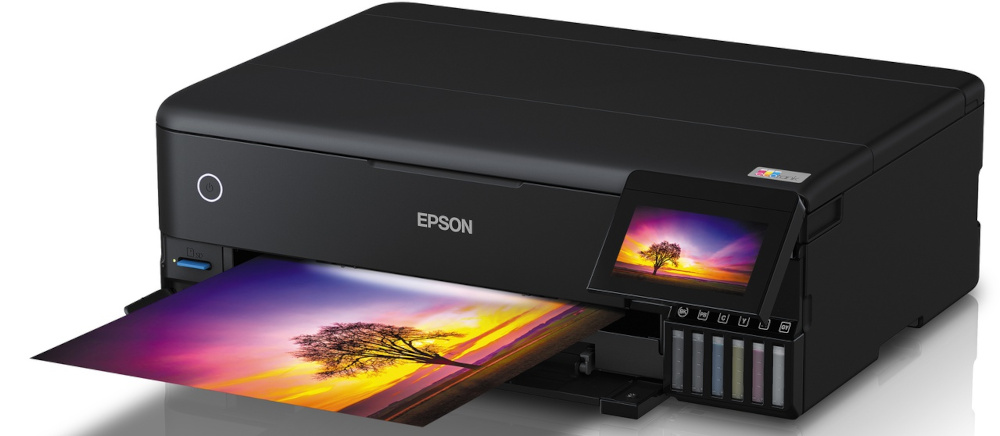 A black Epson printer printing a colorful image.