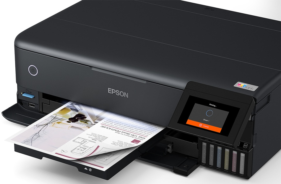 Black Epson printer printing a document, with an orange screen.