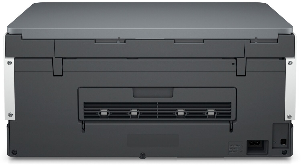 Achterkant van een printer, grijs en zwart, met poorten en stroomaansluiting.