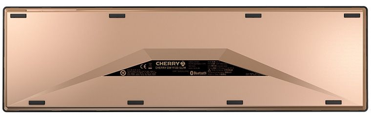 Unteransicht einer goldfarbenen Tastatur, die Basis und Gummifüße zeigt.