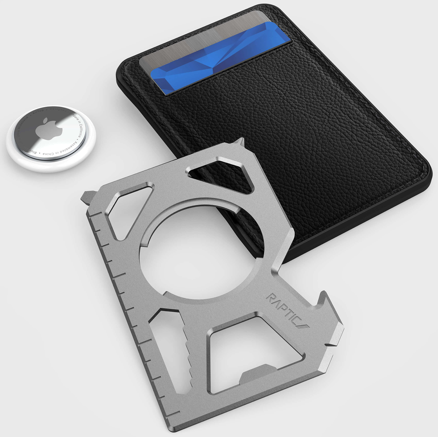 A wallet, an AirTag, and a silver multi-tool. The multi-tool has a ruler and various cutouts.