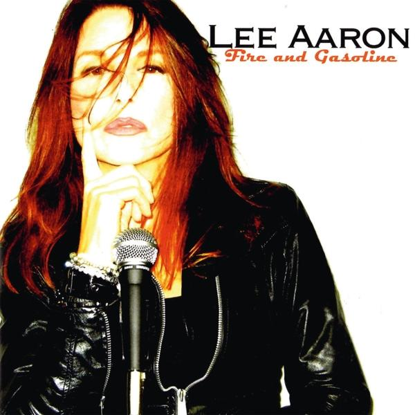 Albumcover. Lee Aaron mit rotem Haar, schwarzer Lederjacke und Mikrofon.