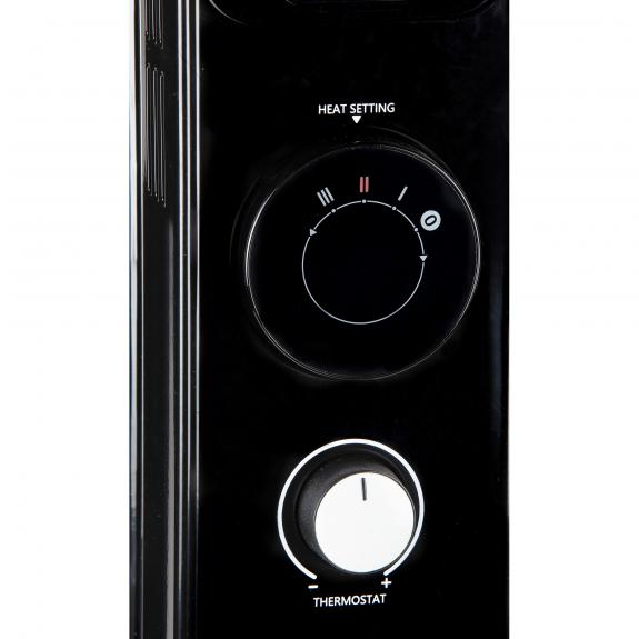 Black heater control panel. Two dials: heat setting and thermostat. White background.