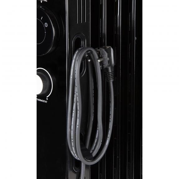Black heater. A gray cable hangs from the side. Control dials are on the left.