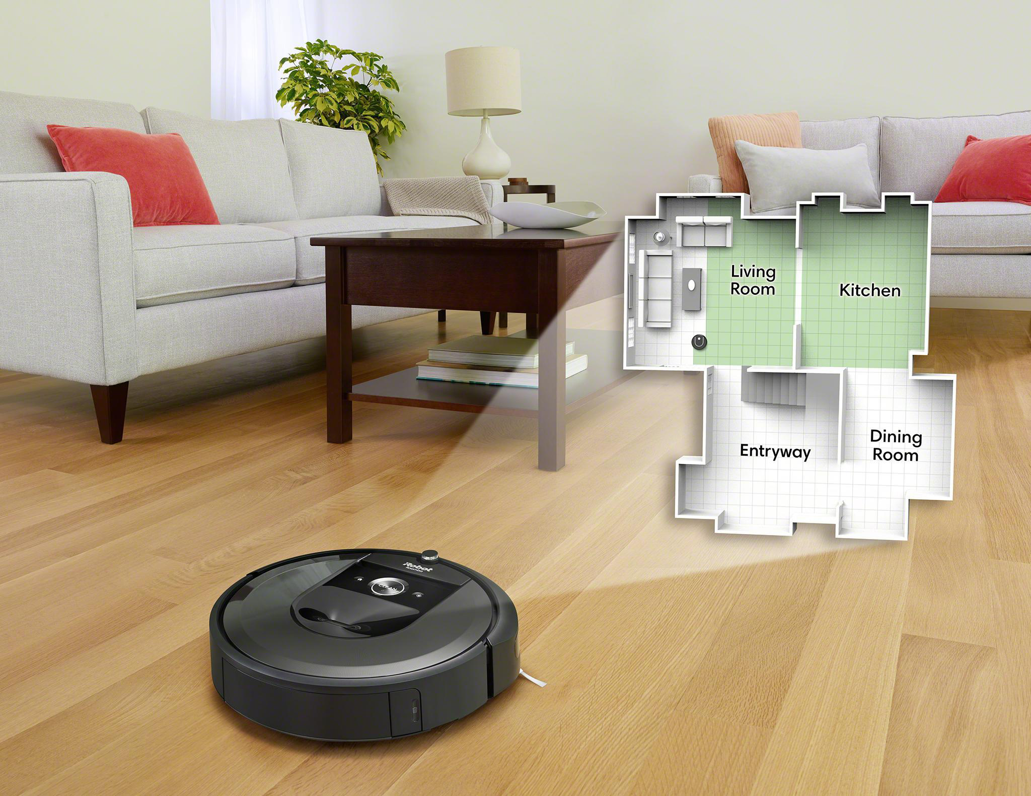 Ein schwarzer Roomba reinigt einen Holzboden. Auf der rechten Seite ist ein Grundriss zu sehen.