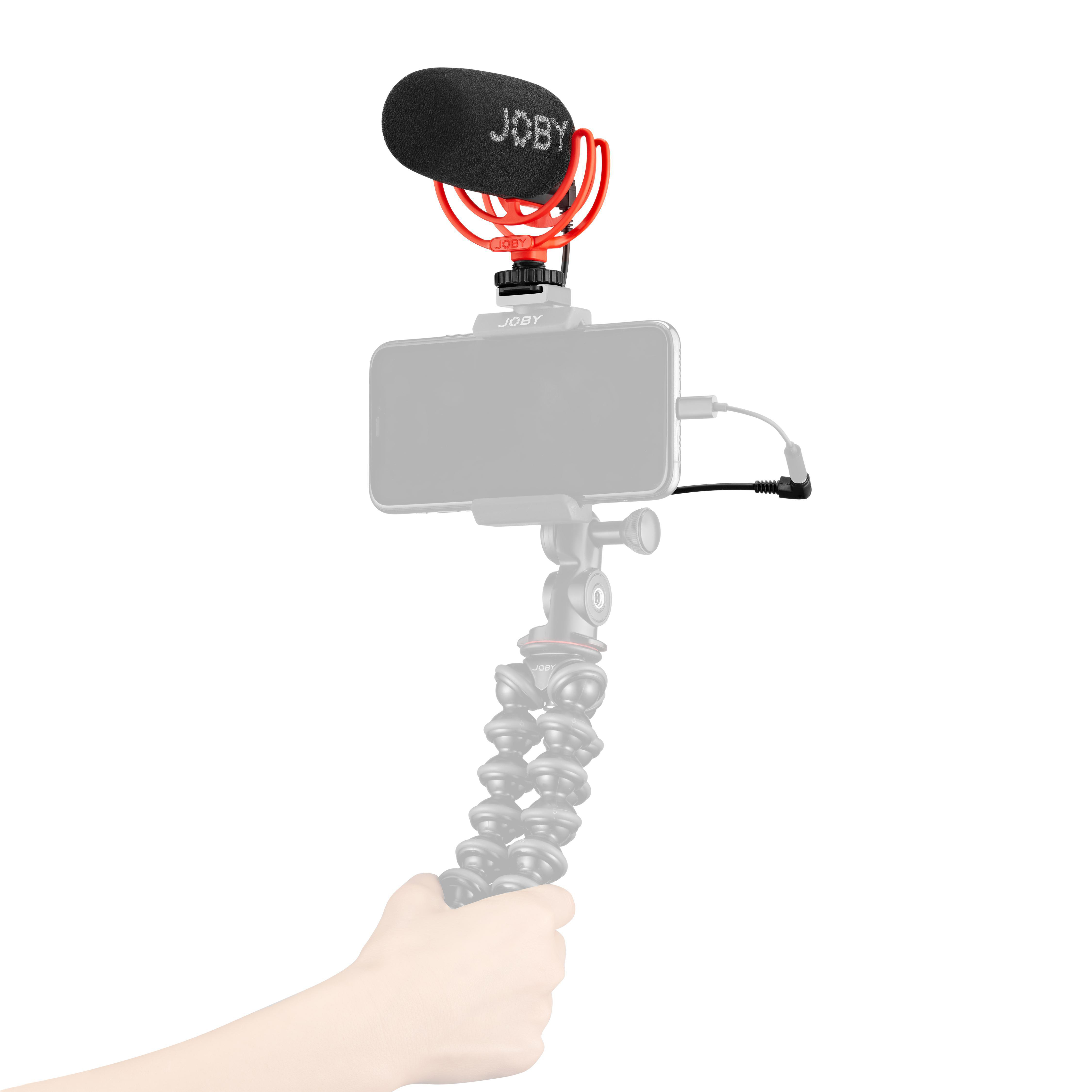 Ein Mikrofon an einem Telefon und einem flexiblen Stativ.