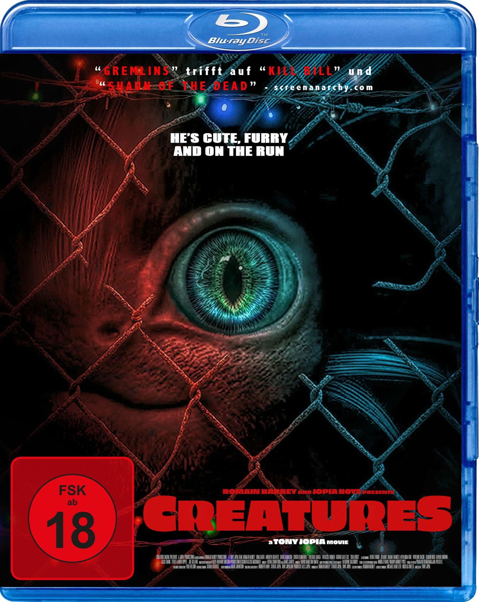 Filmcover von 'Creatures' mit einem gruseligen Auge hinter einem Zaun.