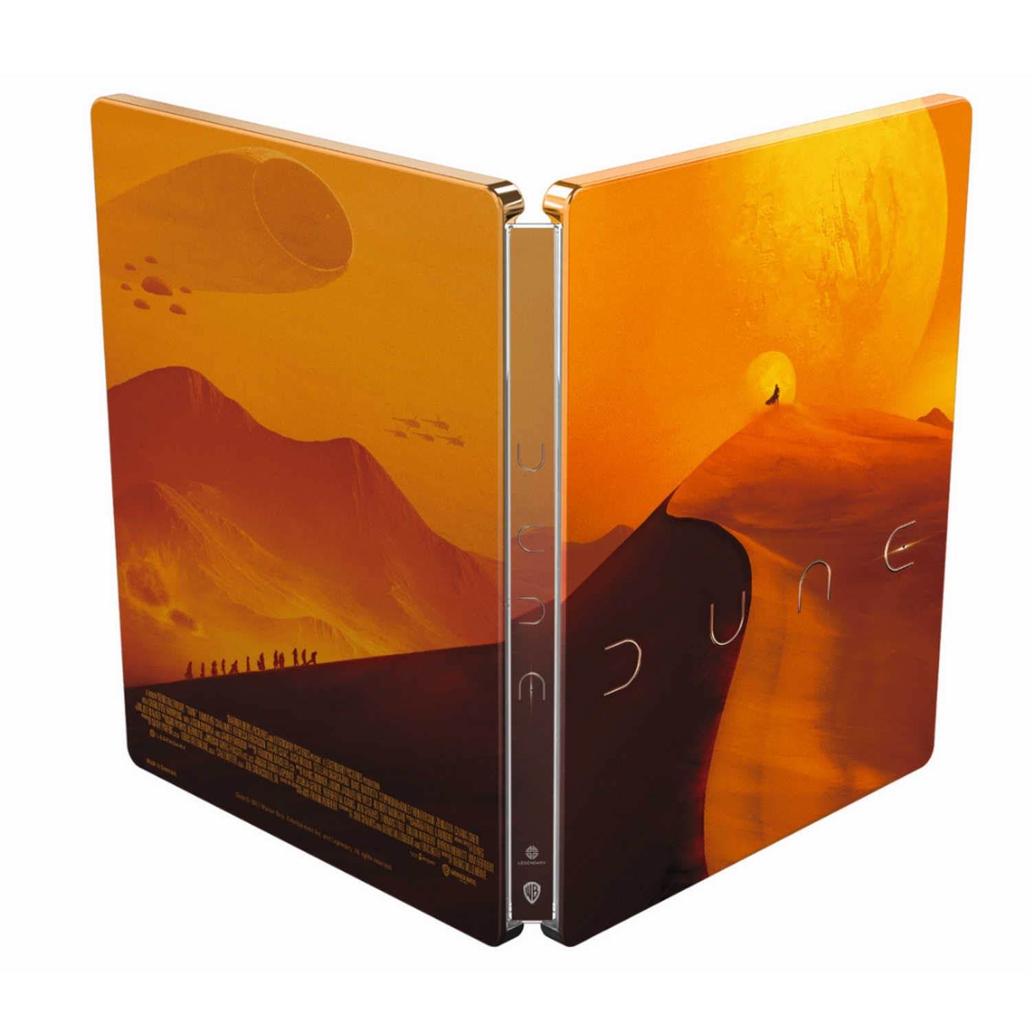 La caja de la película Dune está abierta. La portada es naranja con figuras. El lomo dice Dune.