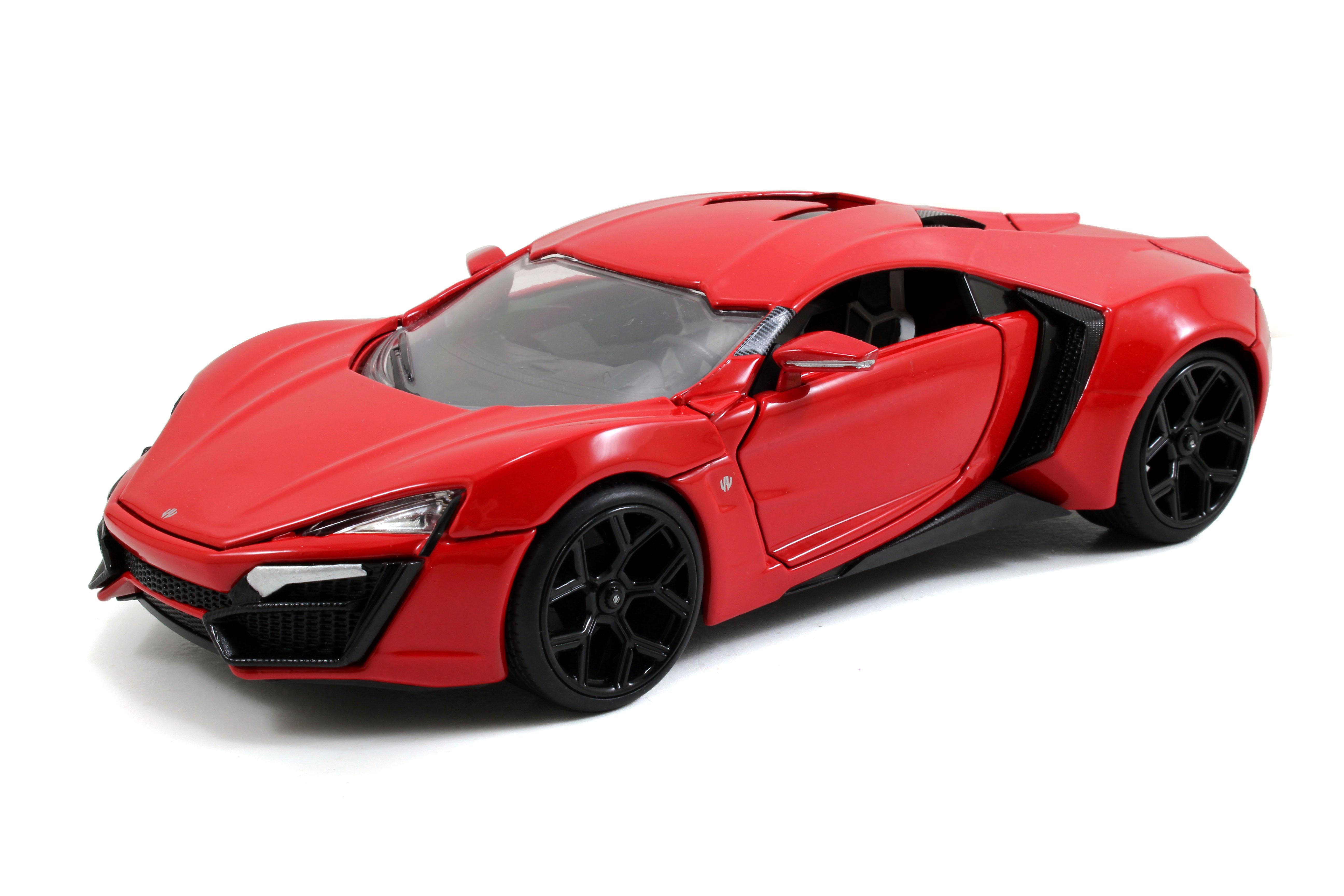 Ein rotes Sportwagenmodell auf weißem Grund. Das Auto hat schwarze Räder und ein schlankes Design.