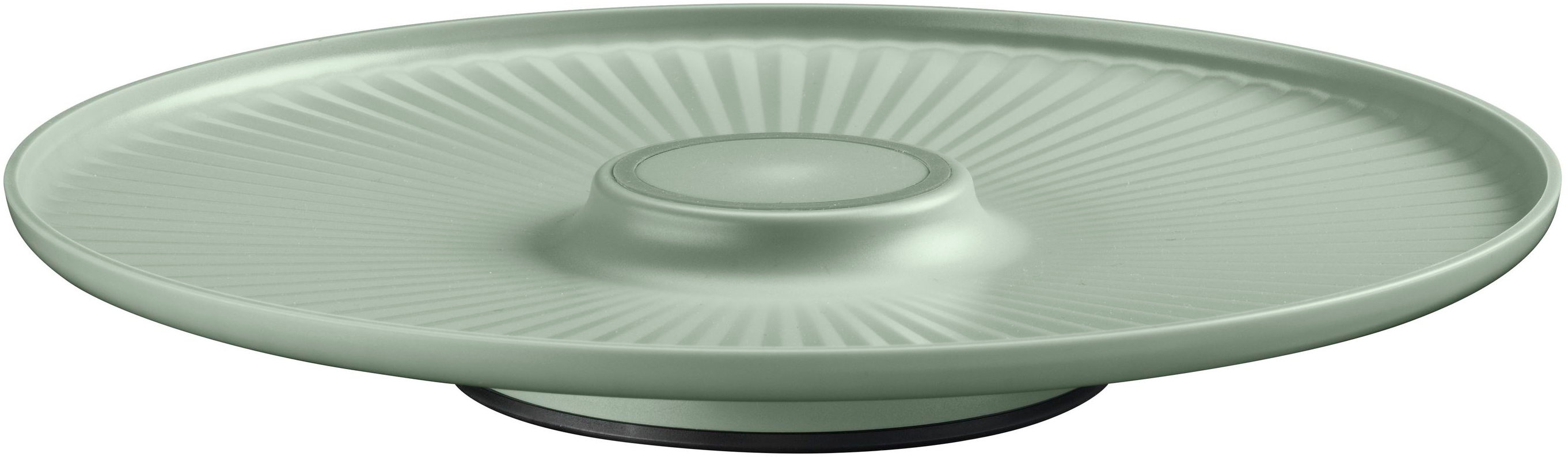 Un plat de service vert clair. Il a une zone centrale surélevée et des arêtes radiales.