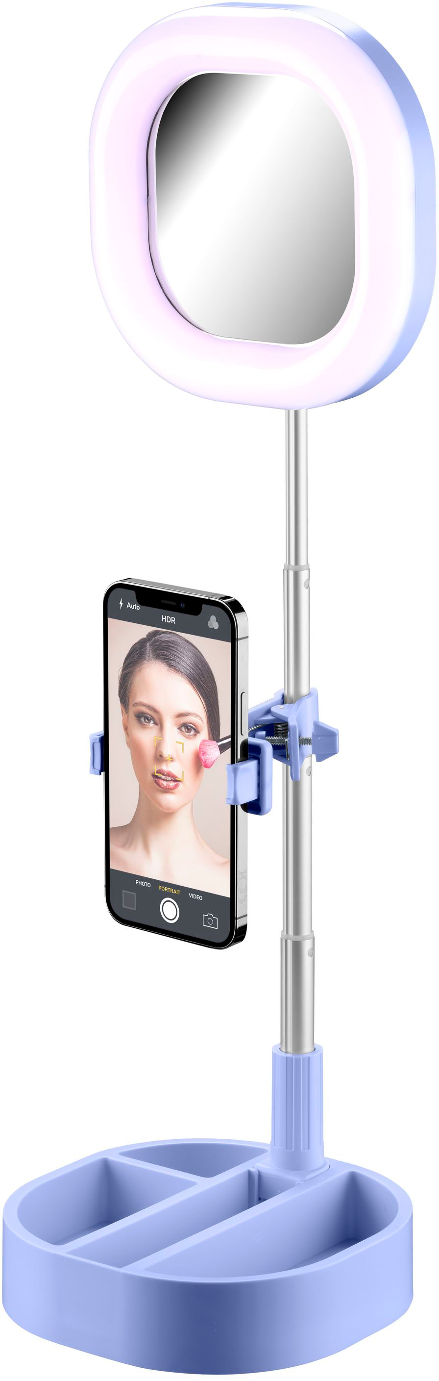 Ein hellblauer Schminkspiegel mit einem Telefon, das ein Selfie hält. Der Spiegel hat ein Ringlicht.
