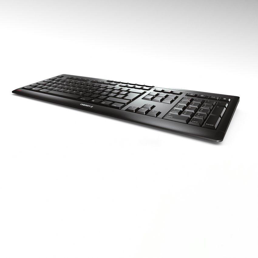 Eine schwarze Tastatur auf einer weißen Oberfläche, von oben betrachtet, mit weißem Hintergrund.
