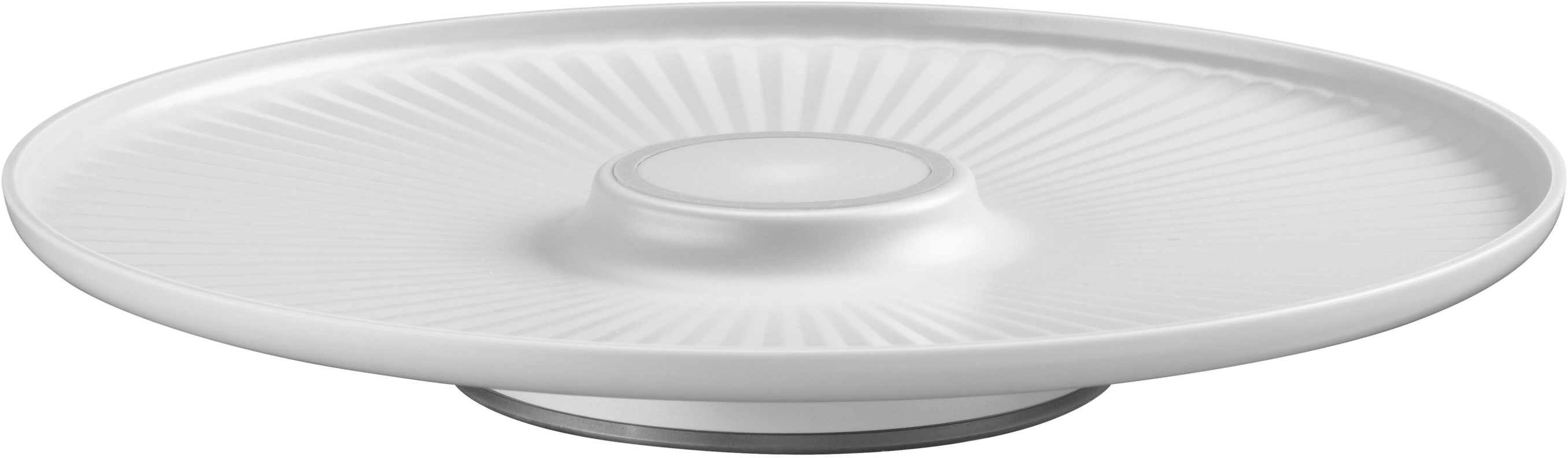 Plat de service rond blanc. Le centre est en retrait. Des lignes radiales s'étendent depuis le centre.