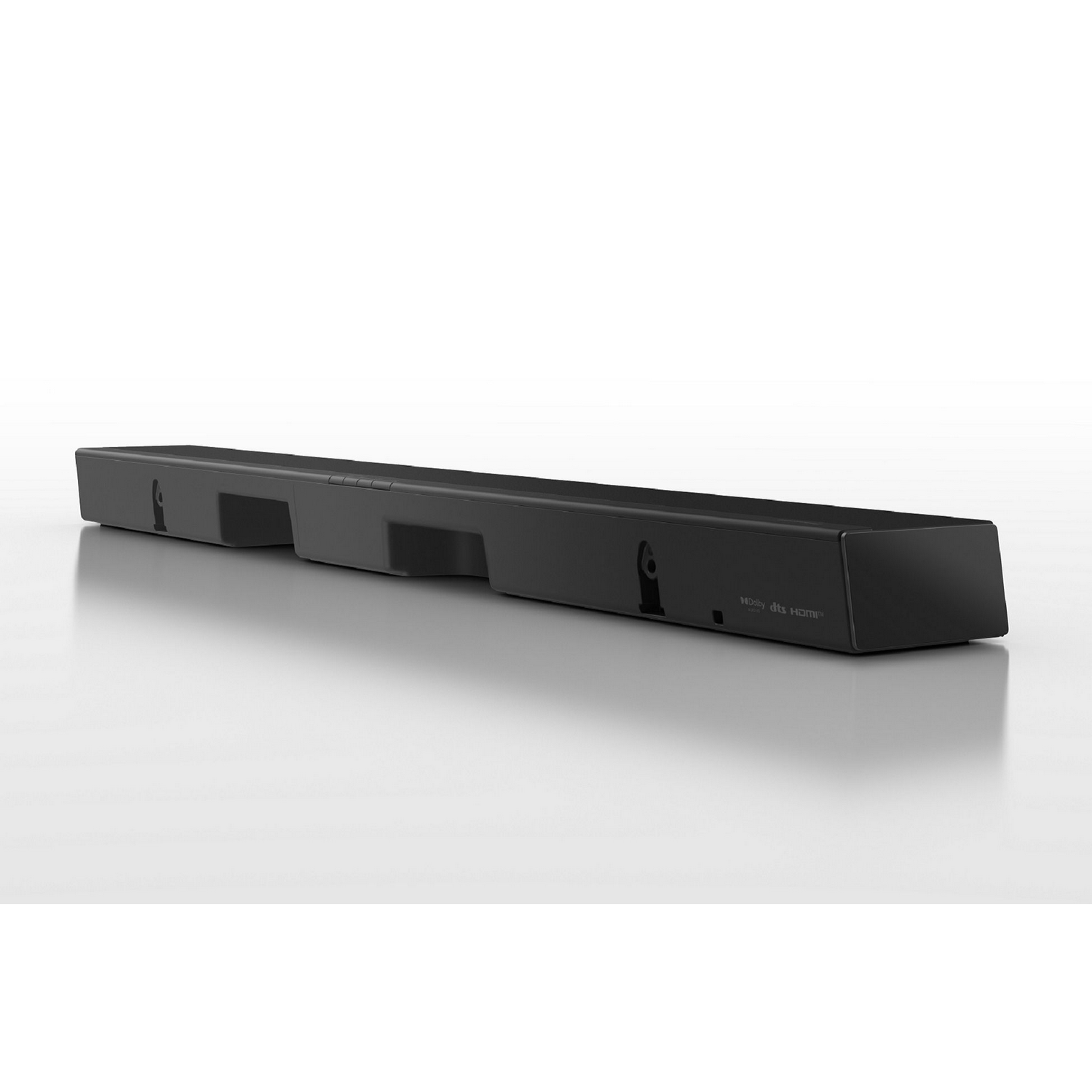 Barra de sonido negra sobre superficie blanca, con logos Dolby y DTS:X.