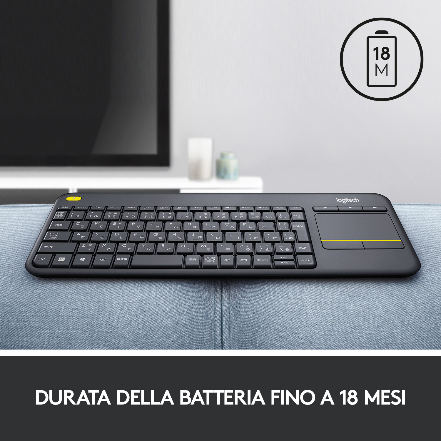 Tastiera nera con caratteri giapponesi, touchpad giallo e indicatore batteria.