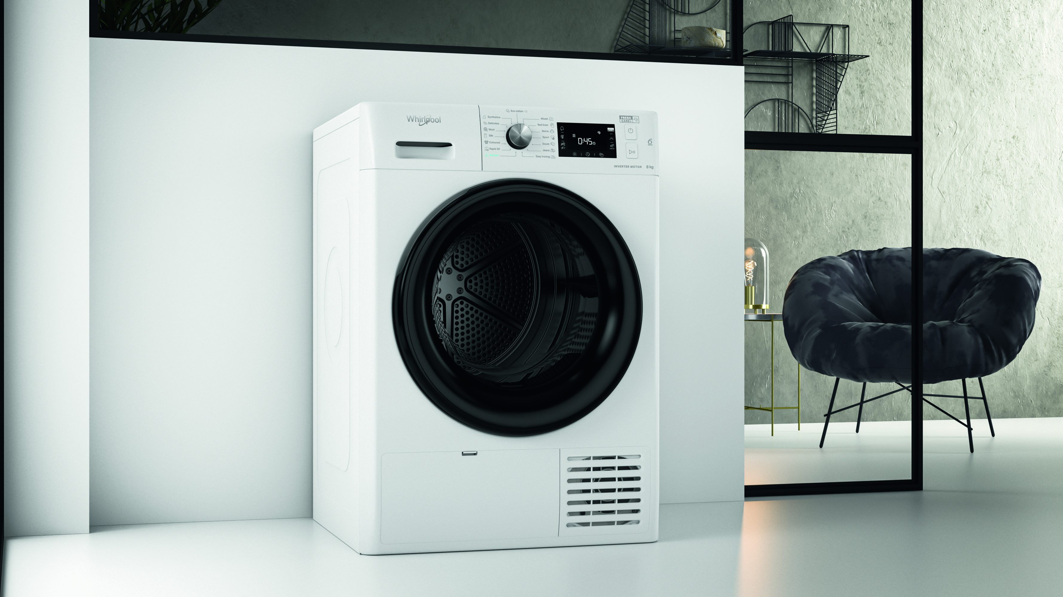 Egy fehér Whirlpool szárító egy modern szobában. Egy fekete szék és asztal egy üvegfal mögött van.