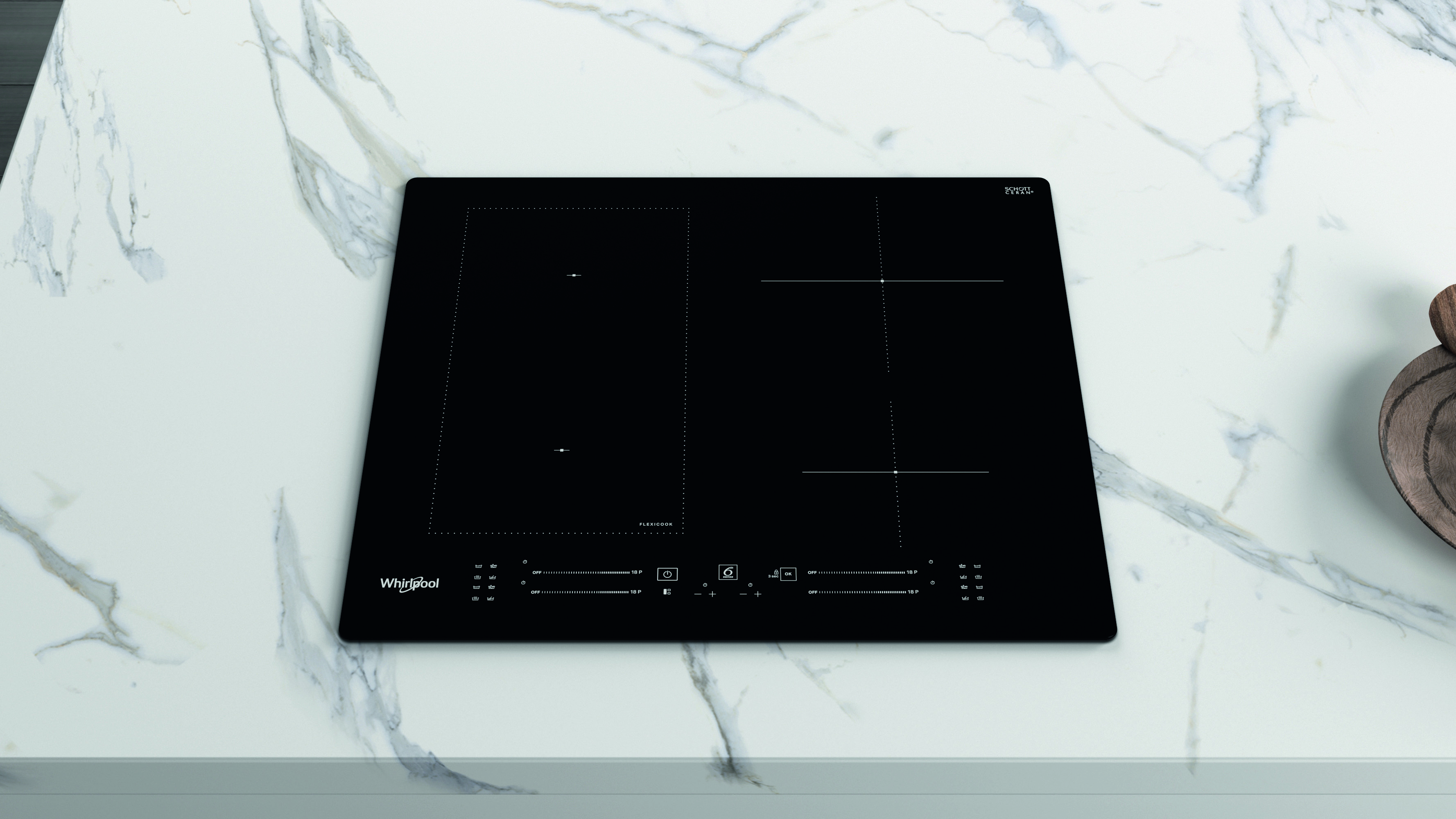 Fekete Whirlpool indukciós főzőlap márvány munkalapon.