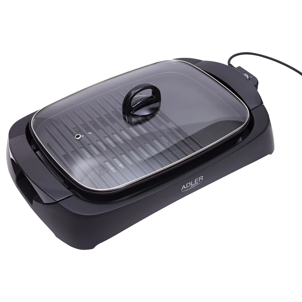 Fekete elektromos grill üvegfedővel és fogantyúval. Van egy tápkábele.