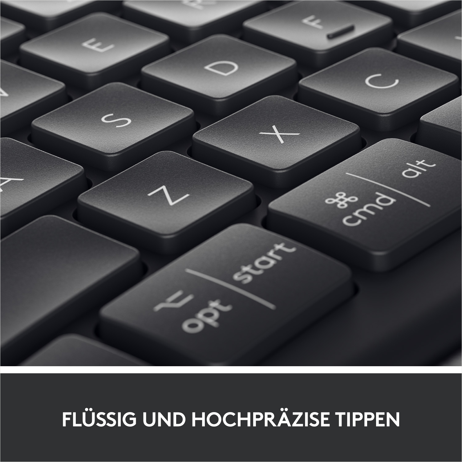 Nahaufnahme einer Tastatur mit dunkelgrauen Tasten. Die Tasten "opt" und "cmd" sind sichtbar.