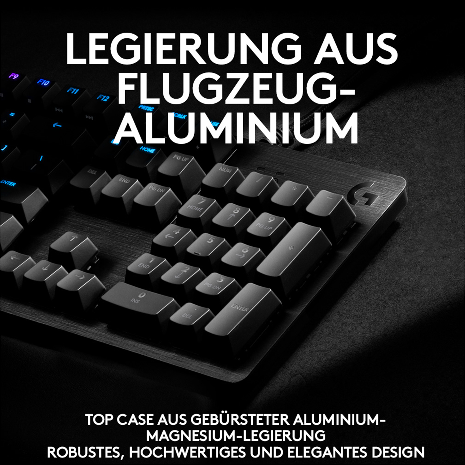 Nahaufnahme einer Tastatur mit Text 'LEGIRUNG AUS FLUGZEUG-ALUMINIUM'. Oberes Gehäuse aus Aluminium-Magnesium-Legierung.