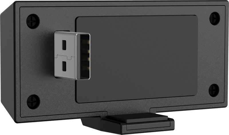 Egy fekete eszköz USB porttal, bedugásra tervezve.