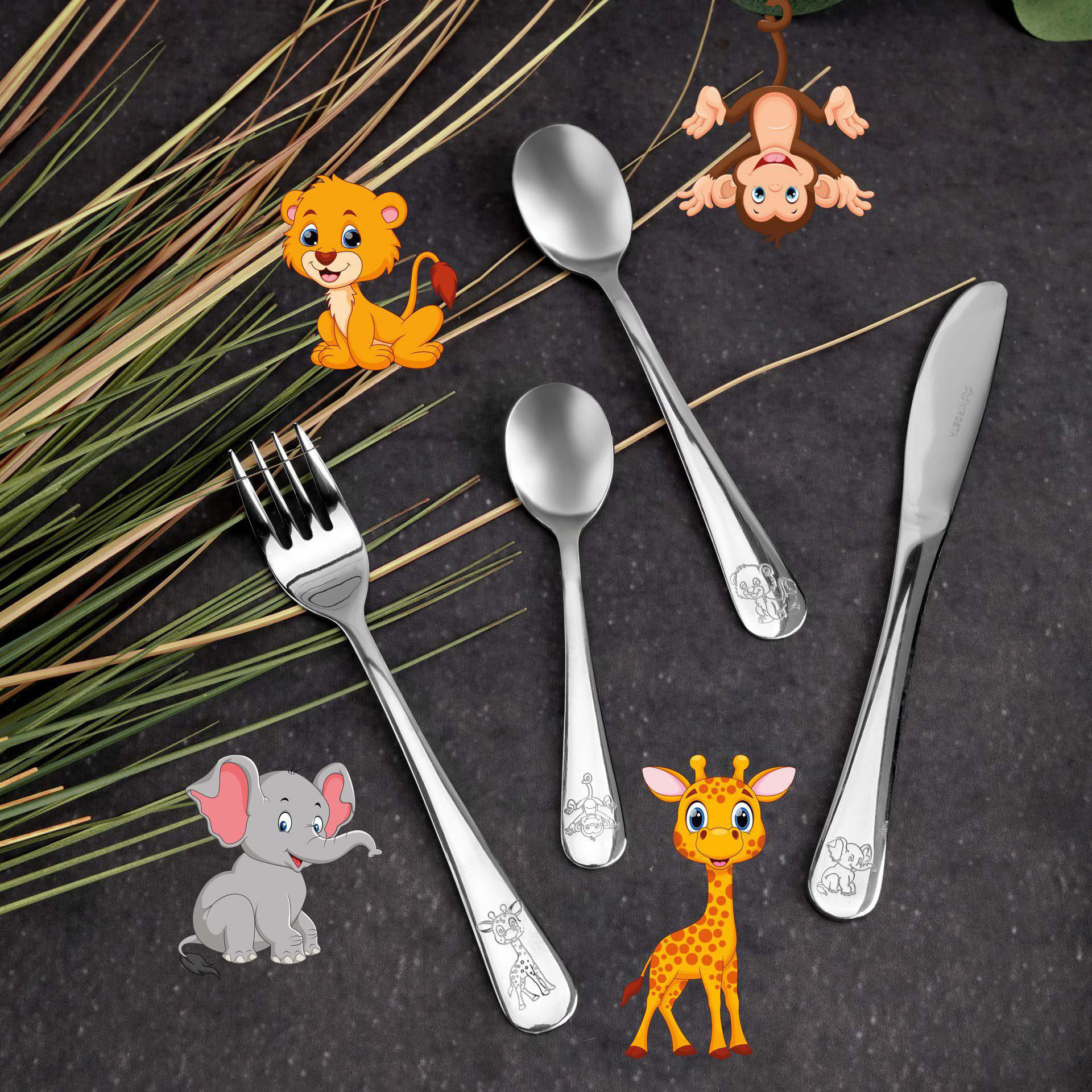 Set von Kinder-Silberwaren mit tierischen Cartoon-Designs. Der Hintergrund ist eine dunkelgraue Oberfläche.